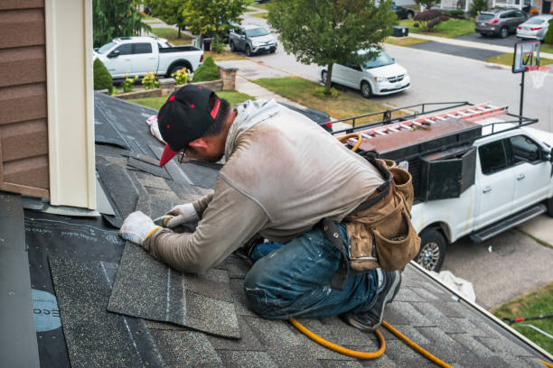 Professional Roof Replacement technician working in Andrew, IA